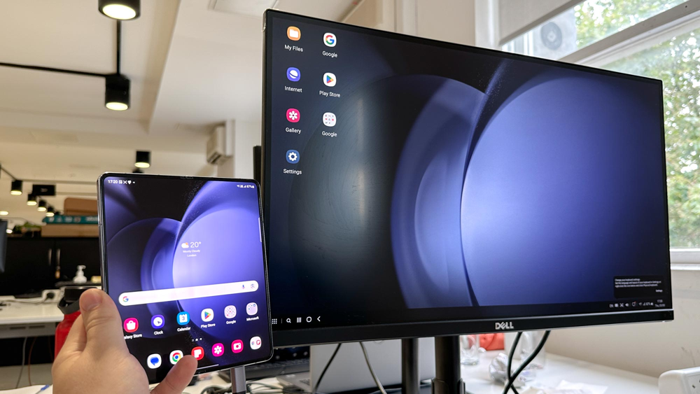Samsung Galaxy Z TriFold in DeX desktop mode, connected to a monitor for dual-screen use.